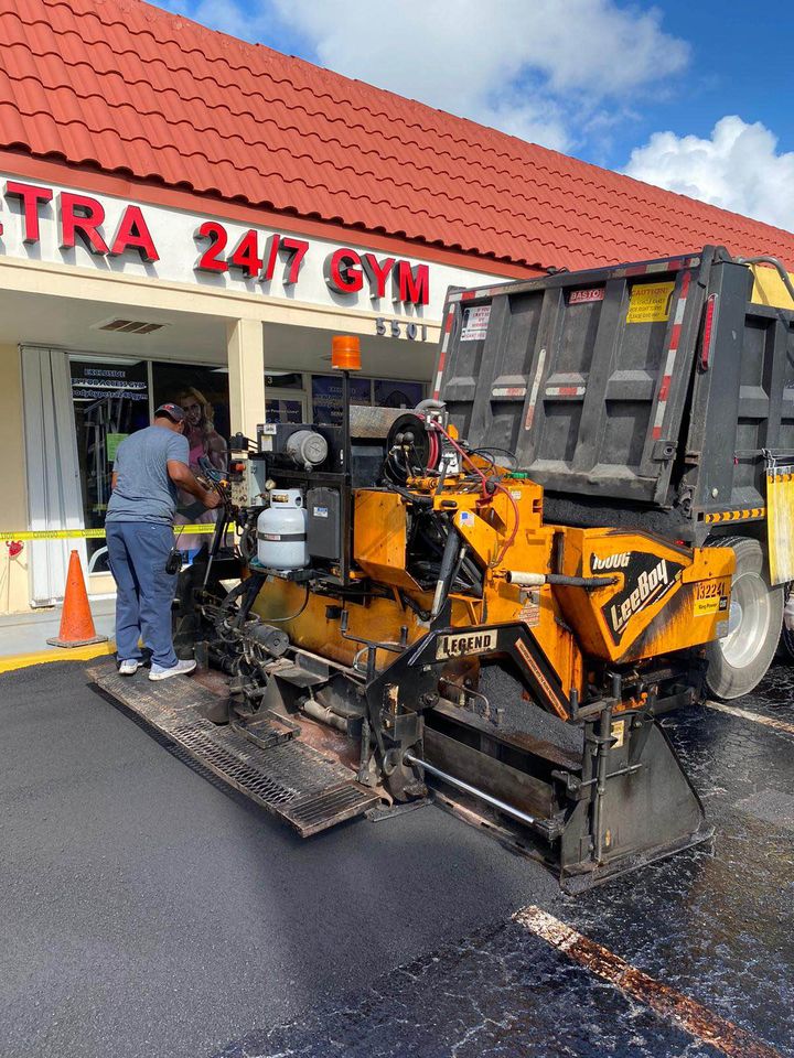 A man standing next to a machine.
